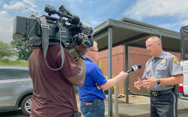 Lumpkin County Sheriff Stacy Jarrard speaks to an Atlanta news station following the 24-hour manhunt and apprehension of Gerardo Jonathan Flowers.