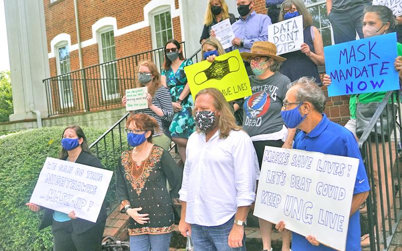A group of University of North Georgia professors and faculty gathered for a quick rally in favor of a mask mandate being enforced indoors at UNG.