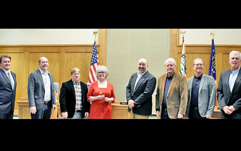 Former and new city council members gathered together at the January 4 meeting, where three new members: Ryan Reagin, far left, Ross Shirley, far right, and Mayor JoAnne Taylor, center, were sworn in.  Also pictured are, from left, council members Roman Gaddis, Johnny Ariemma, former mayor Sam Norton, council members Ron Larson and Joel Cordle.