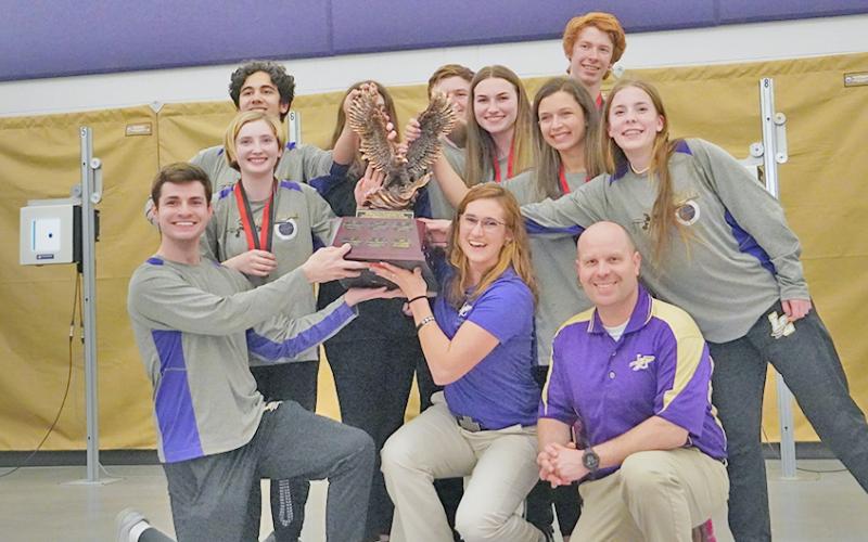 Members of the LCHS Rifle team celebrate with the elusive Area 6 trophy after defeating all six teams in the area to claim the title and No. 1 seed heading into the State playoffs.
