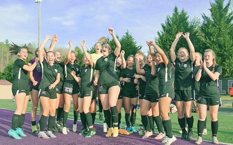 The LCHS Girls Soccer team celebrates its first-round win over Sandy Creek last Tuesday. After Monday’s win over Pierce County, the Indians are Elite Eight bound.