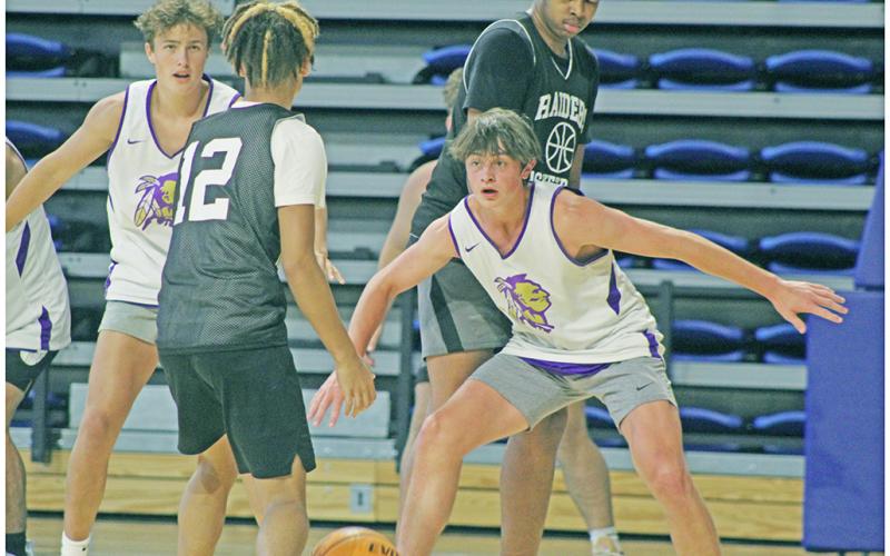 LCHS Boys Basketball players Jac Chambers (right) and Walker Scott focus in to try and make a play on the defensive end during UNG’s Team Camp last week.