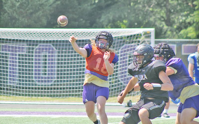 Rising senior Cooper Scott delivers a pass during a skill position scrimmage during last week’s football camp. Lumpkin played host to four other teams for a two-day padded camp to add some extra competition to their practices this summer.