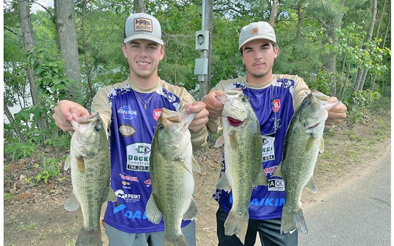A.J. Moss (left) and Carder Dockery show off their catches for the weekend as the duo competed in the B.A.S.S. Nation Georgia High School State Championship last Friday and Saturday on Lake Hartwell. The team earned 13th place with their five fish weighing in at 25.19 lbs.