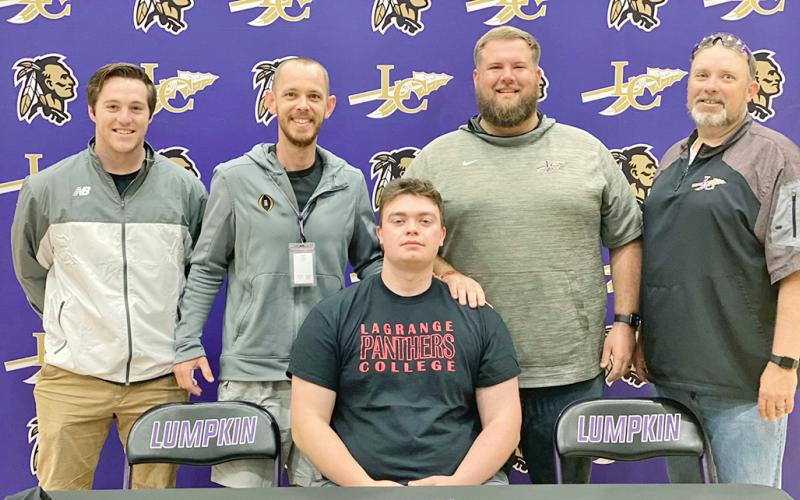 Graduating senior Cameron Simpson signed to play college football at Lagrange College earlier this year. Pictured with Simpson at the ceremony are coaches (from left): Andrew Hinchliffe, Caleb Sorrells, John Dye and Steve Horton.