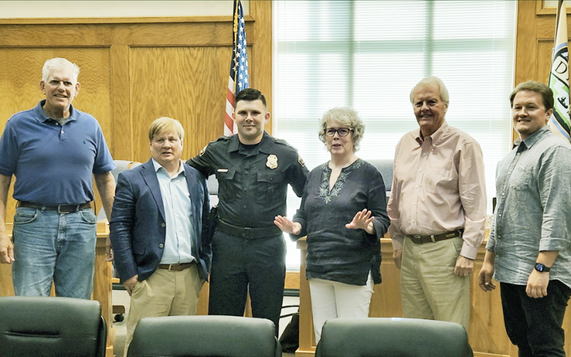 Officer Chris Weeks, third from left, was honored alongside, from left, Ross Shirley, Johnny Ariemma, Mayor JoAnne Taylor, Ron Larson and Ryan Reagin.