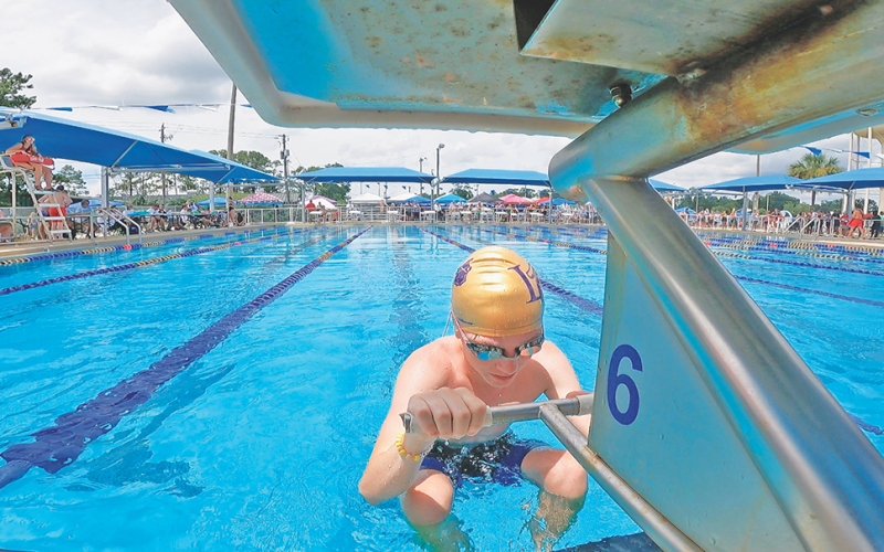 Blake Knepper prepares for take off in one of his events at the state swim meet in Tifton last weekend. The Lumpkin County Swim team brought home a program-best 21 medals from the season finale, marking the end to a successful season.