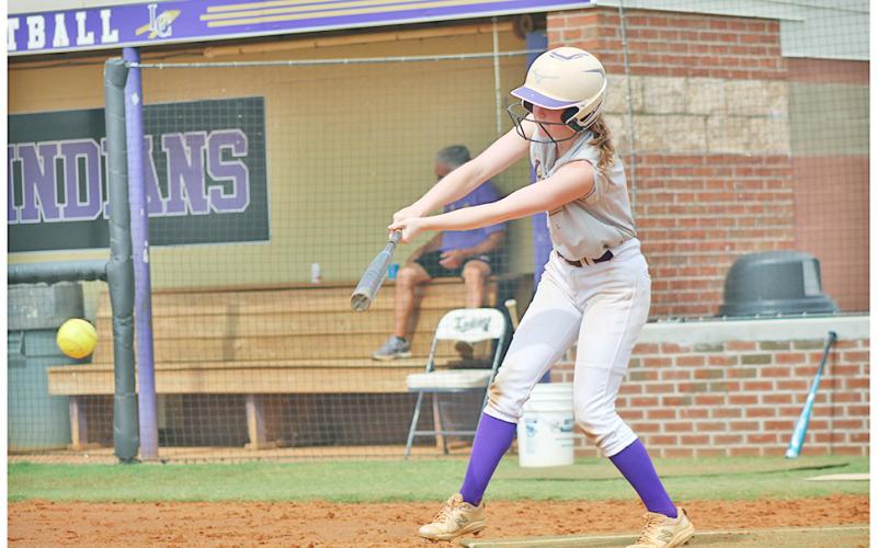 Lumpkin softball’s Sydney Moore works on her two-strike approach at the plate during a recent June practice.