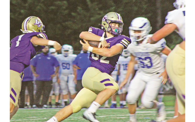 Junior fullback Mason Sullens (32) rushed for 121 yards on 13 carries and scored four touchdowns as Lumpkin won its season opener.