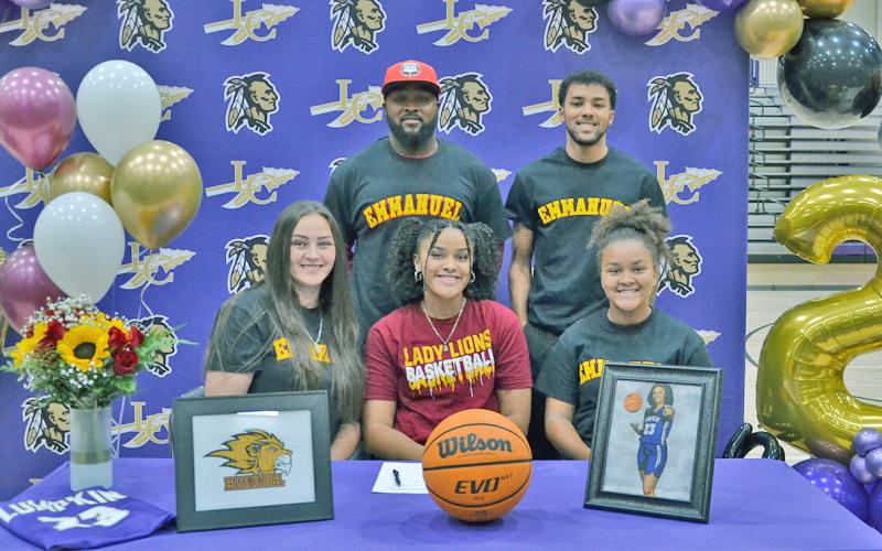 Kate Jackson celebrates her scholarship signing along with (front row, left) mother Janet Jackson, sister Keira Jackson, (back row) dad Patrick Jackson and brother Pat Jackson.
