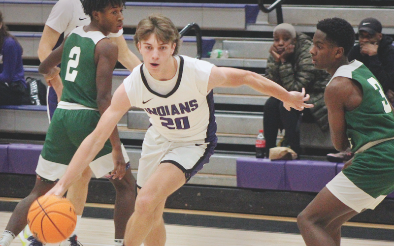 Lumpkin sophomore TJ Gaddis advances the ball toward the basket in the Indians’ victory over Cross Keys.