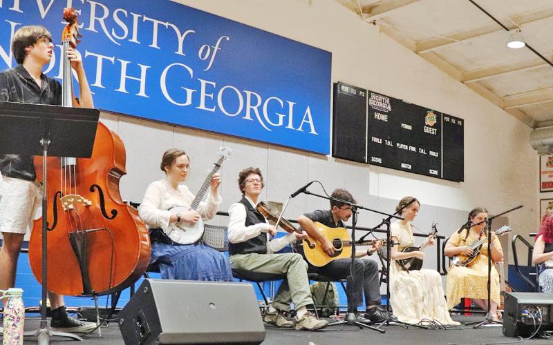The members of the Licklog String Band perform at a spring contra dance at the University of North Georgia. (Photo by Sharon Tran)