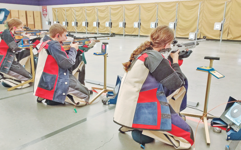 LCHS Rifle team sharpshooters, from left, Laura Hoch, Freshman JT Wright and Brynn Foster take aim while facing off against Riverside on November 15.
