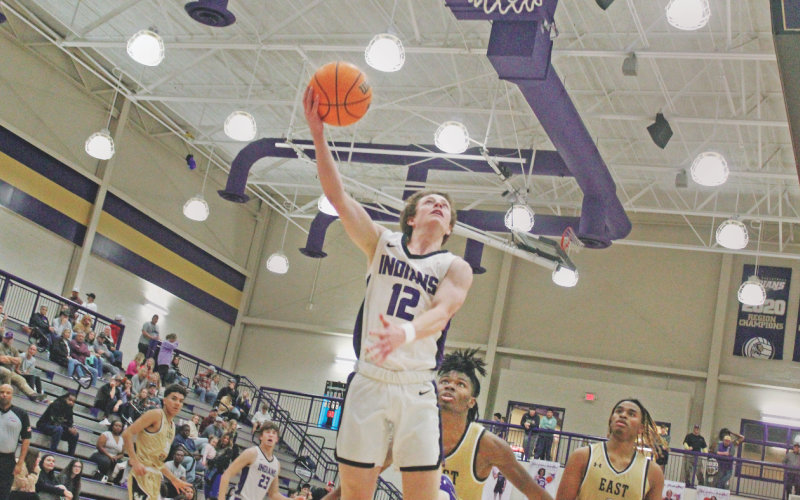 Lumpkin County junior Stephen Sherrill drives in for a shot versus East Hall during the Gold City Shootout last week.