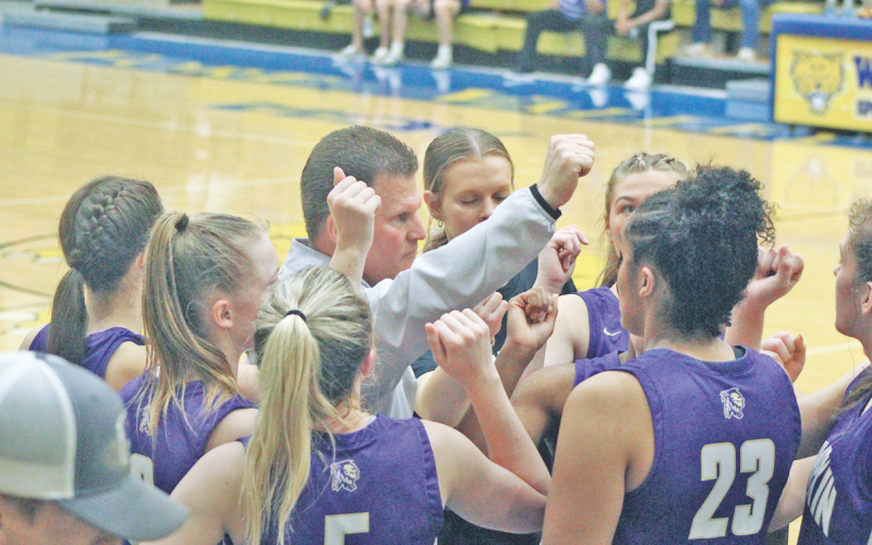 Girls basketball Head Coach David Dowse rallies the Lumpkin team during a timeout in the Lady Indians Final Four victory. The team will play in the finals this Friday.