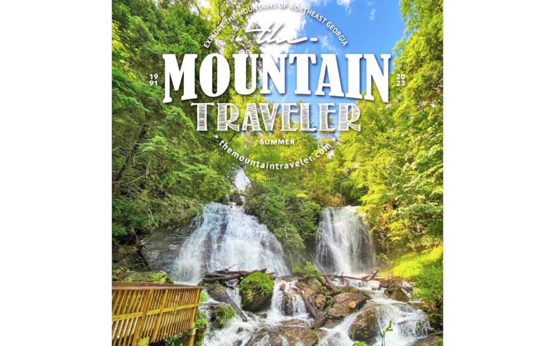 Cornelia resident Donna Shirley receives her $100 prize money from Alan NeSmith, Community Newspapers Inc. chairman. Shirley’s photograph of the double waterfalls that make up Anna Ruby Falls graces the cover of the 2023 summer edition of The Mountain Traveler magazine.