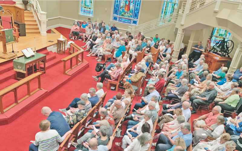 A crowd gathers in the sanctuary of Dahlonega United Methodist Church on August 6 as an overwhelming majority of the members ultimately voted to disaffiliate from the United Methodist Church.