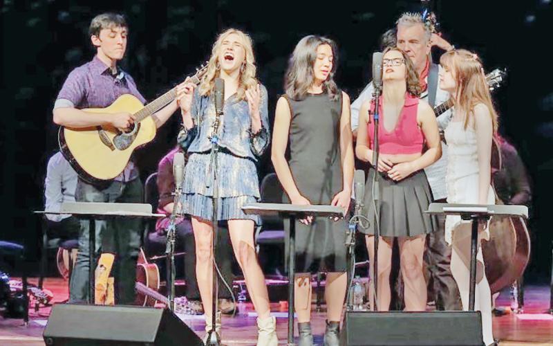 Local artist Mia Dierkes, second from left, takes to the stage in Memphis, Tennessee to close out the Acoustic Music Project.