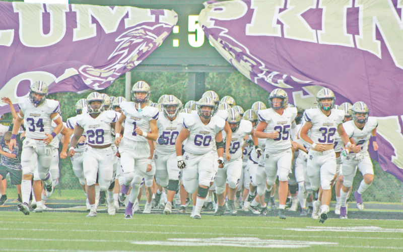 Lumpkin County storms the field to take on the Temple Tigers.