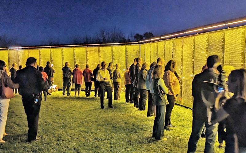 Evening visitors in Spartanburg, South Carolina view The Wall That Heals during a stop on the popular exhibit’s 2023 tour. The wall will visit Dahlonega at the end of October. (Submitted photo)