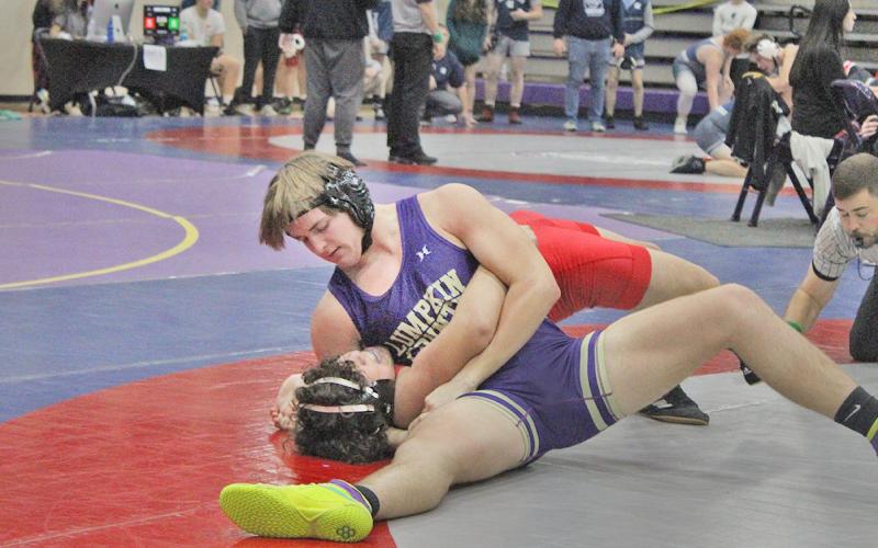 Eighth ranked Will Soles pins one of his opponents at the Gold City Holiday Nutcracker tournament.