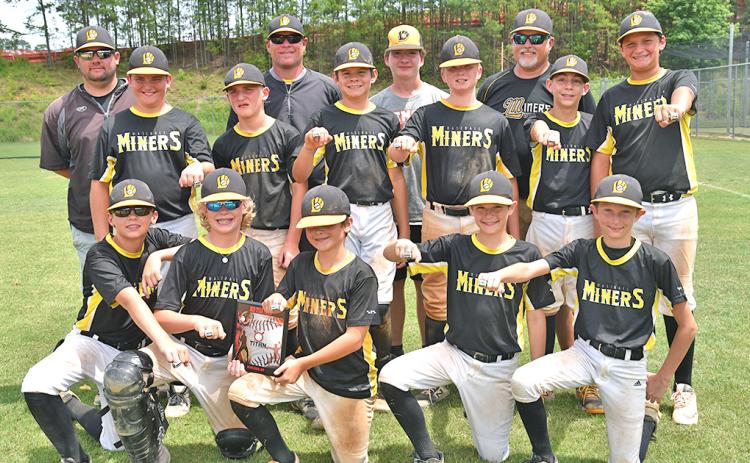The Lumpkin Miners 12U baseball team shows off their runner-up rings from one of the tournaments they participated in during the 2019 spring season. The Miners went 26-14 during the three-month season.