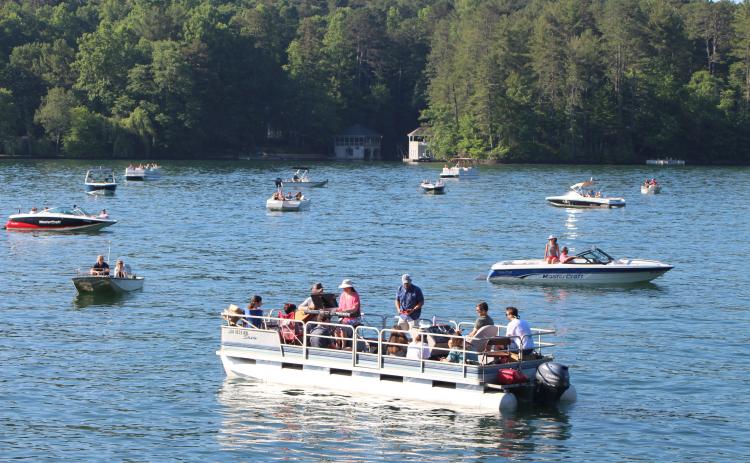 Boats gather on Lake Rabun for boat church, a service of Clayton First United Methodist Church. PHOTO/MEGAN BROOME
