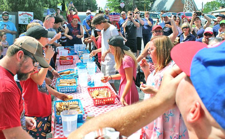 A total of 11 participants came to downtown Dahlonega to compete for a $100 prize and the honor of being the first Fourth of July hot dog eating contest champion.