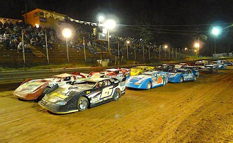 Cars running two across roar down the straightaway during a feature race at Toccoa Raceway. Photo racingin.com