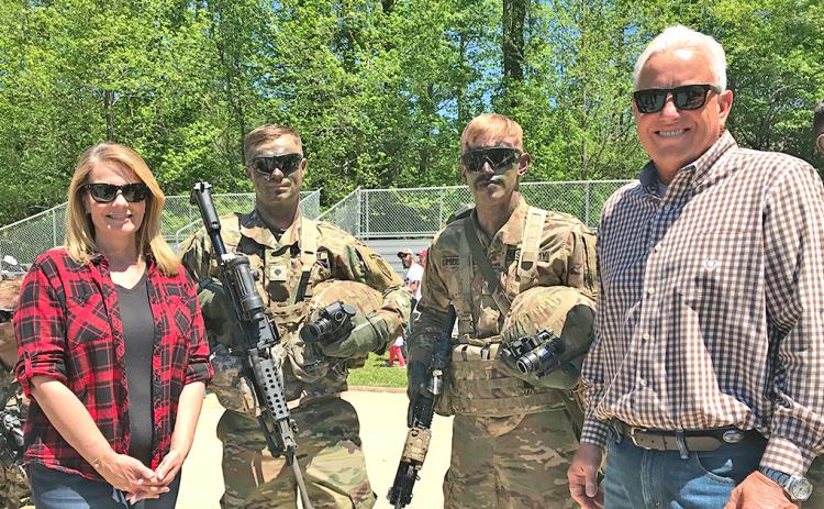 Jann Carl and Rodney Miller spend time with Army Rangers at Camp Frank D Merrill during filming earlier this year.