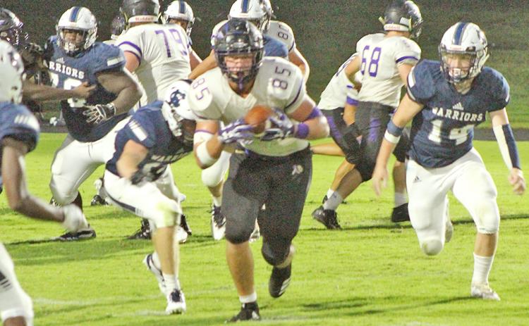 LCHS tight end Aaron Hopkins picks up some yards after catching a pass from Indians quarterback Tucker Kirk in the third quarter of Lumpkin’s game against White County last week.