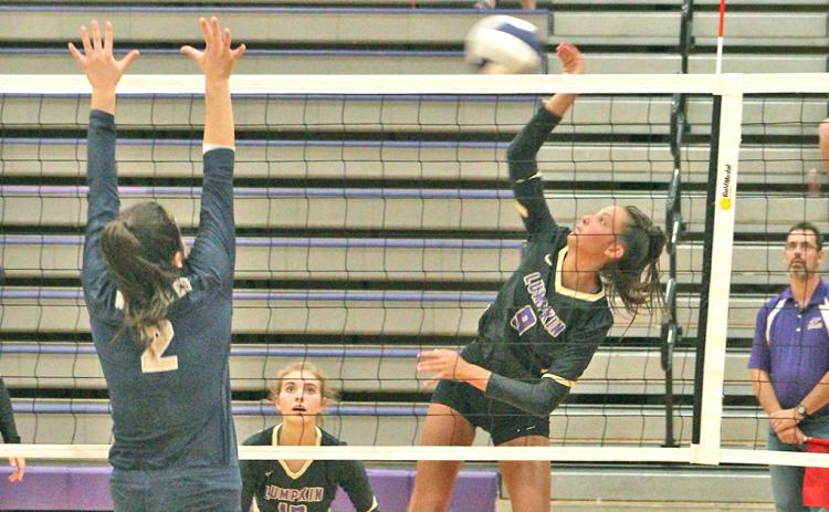 Lady Indians player Kiersta Trammell puts a powerful hit on the ball at the net for a kill during Lumpkin’s win over Prince Avenue Christian last week.