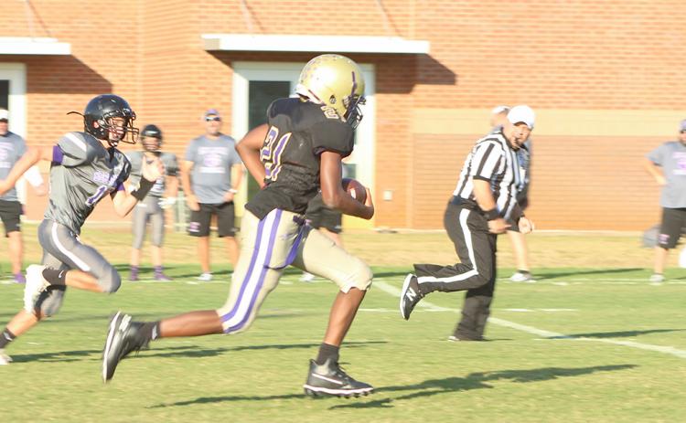 LCMS standout Gerald Walker returns an interception for a touchdown in the 7th grade team’s blowout win over Gilmer County in the Mountain League semifinals.