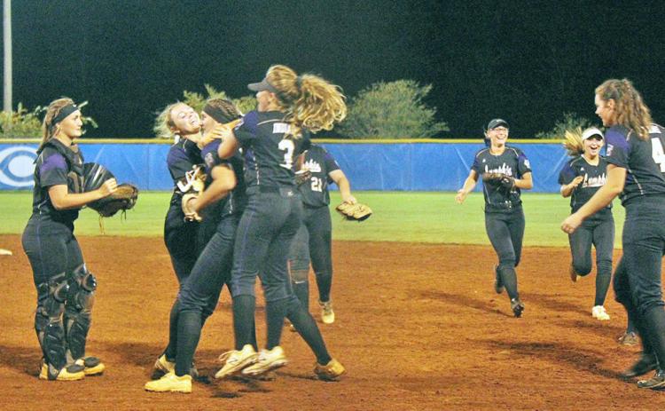 The Lady Indians celebrate their sweep of the Crisp County Lady Cougars in the Sweet 16 round of the GHSA State Softball Playoffs on Oct. 16.
