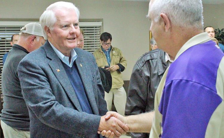 Dahlonega City Councilman Ron Larson is congratulated by County Commissioner Bobby Mayfield on election night.