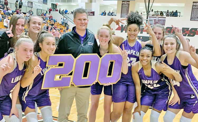 The Lady Indians celebrate LCHS head girls basketball coach David Dowse’s 200th career win after defeating the Chestatee Lady War Eagles in Lumpkin’s 2019-2020 season opener.