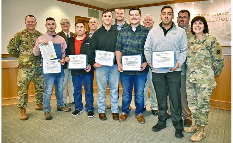 Local residents who served in the Georgia National Guard 48th Infantry Brigade were honored by Lumpkin County Board of Commissioners for their service in Afghanistan as one of the last acts of 2019. Attending last week’s meeting were (front row, from left) Lt. Comm. Nathaniel Stone; staff sergeants Ashton Sanford, Jose Alvarez and Nick Bauth,  1st lieutenants William Mayfield and Edgar Rojas and National Guard Chaplain Maj. Leslie Chandler. Board of Commissioners David Miller, Jeff Moran, Rhett Stringer, Bo