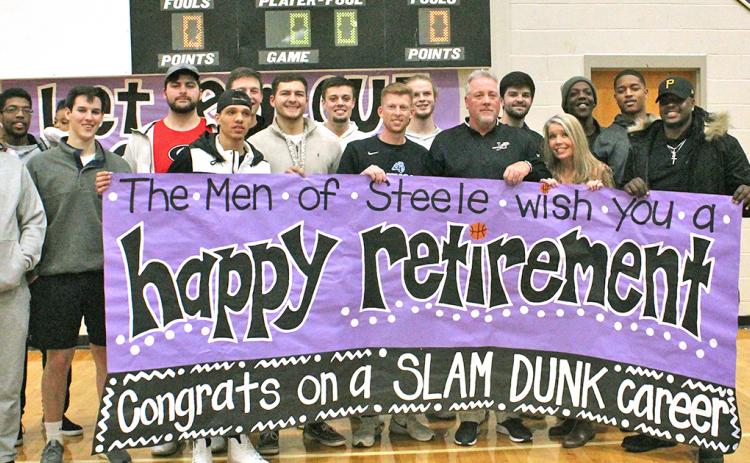 Former Johnson High School and Lumpkin basketball players celebrate the career of LCHS head boys basketball coach Jeff Steele after he announced his retirement.