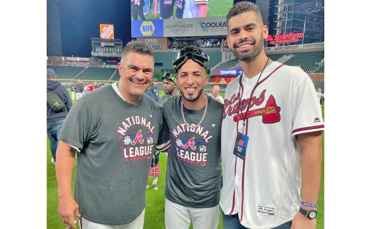The two MVP Eddies, (from left) Braves coach Eddie Perez and outfielder Eddie Rosario join former UNG catcher Andres Perez as he celebrates the Braves NLCS victory that clinched the team's ticket to the World Series with his dad. Andres said watching Rosario's miraculous NLCS MVP performance felt like getting to watch videos of his dad during the 1999 NLCS when he also won series MVP and led the Braves to their last World Series appearance, when Andres was only one year old.