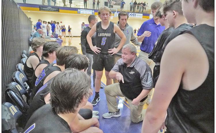 Head coach Michael Parker draws up a play late in Lumpkin’s close loss at Union County on Thursday. The Indians had a chance to tie with 0.5 seconds left, yet were unable to convert the needed basket, falling 55-53.