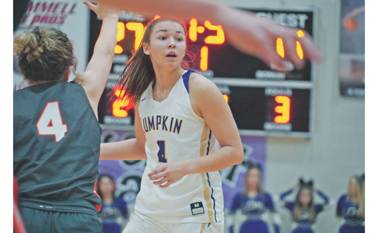 Averie Jones looks to her left for an open teammate in Lumpkin’s game against East Forsyth on Tuesday. Jones dropped 34, including 21 in the first half, to lead the Indians in the team’s first region win of the season.