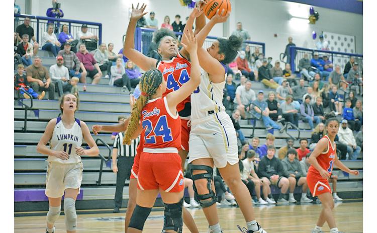 Junior center Kate Jackson goes up strong, taking on contact from two defenders mid-shot. Jackson averaged 9.3 points and 3.6 steals per game during the LCHS hosted Kelly King Holiday Classic on Dec. 28-30 where the Indians swept the competition en route to earning the championship trophy.
