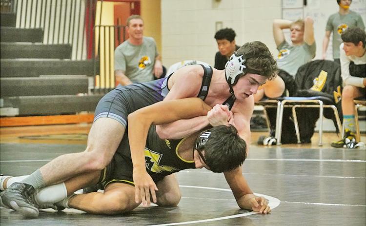 Lumpkin wrestler T.J. Payne maintains complete control of his opponent on the mat, eventually holding on for a decisive 2-1 win in his match on Saturday.