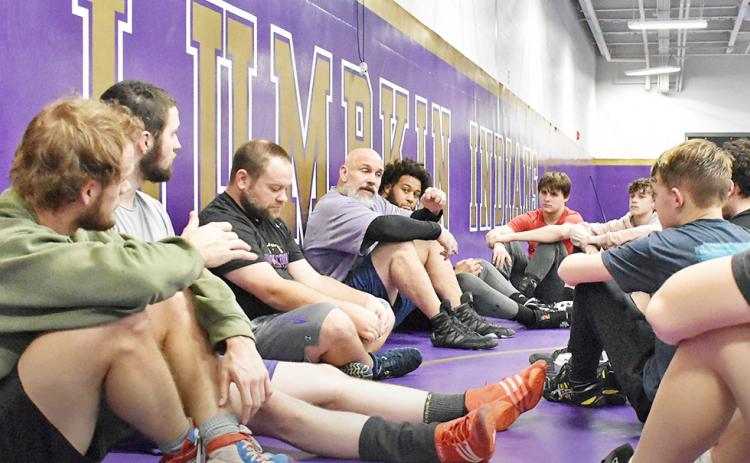 Lumpkin head coach Sean Hage addresses wrestlers in the team’s final practice before the Murray County Invitational.