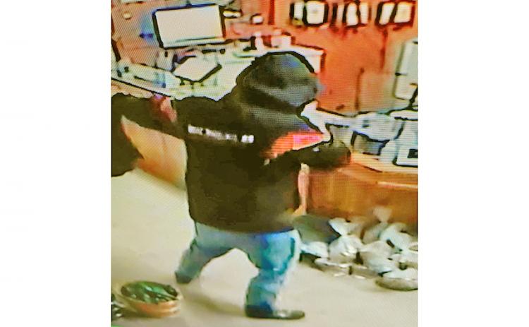 A surveillance camera recorded video of a masked man in an armed robbery at Crisson Gold Mine earlier this month.