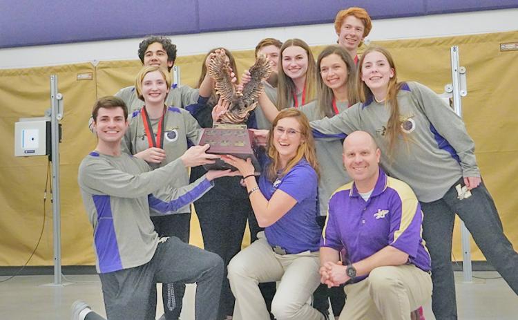 Members of the LCHS Rifle team celebrate with the elusive Area 6 trophy after defeating all six teams in the area to claim the title and No. 1 seed heading into the State playoffs.