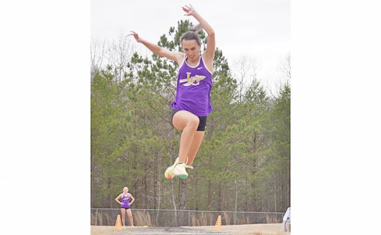 Senior and team captain Mercades Housman takes first place in Triple Jump, an event she went all the way to the state finals in last season.