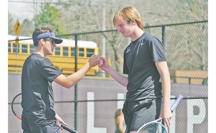 Doubles No. 1 teammates (from left) Jack Lowry and Jack McKinney celebrate after a point during Lumpkin’s Region Tournament matches.