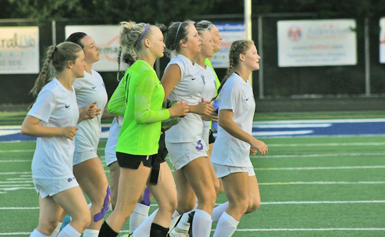 The LCHS Girls Soccer team jogs off to thank their supporters one last time in the 2022 season as the team fell just short of advancing to the Final Four with a 2-0 loss to Oconee County on Monday.