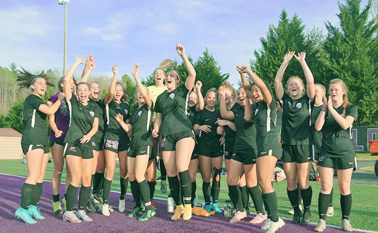 The LCHS Girls Soccer team celebrates its first-round win over Sandy Creek last Tuesday. After Monday’s win over Pierce County, the Indians are Elite Eight bound.